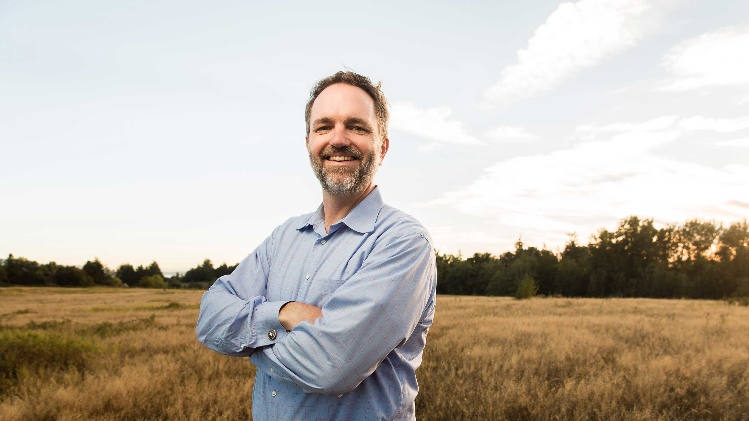 Cultivate Development Profile - President - Matt McCoy - Standing in a field